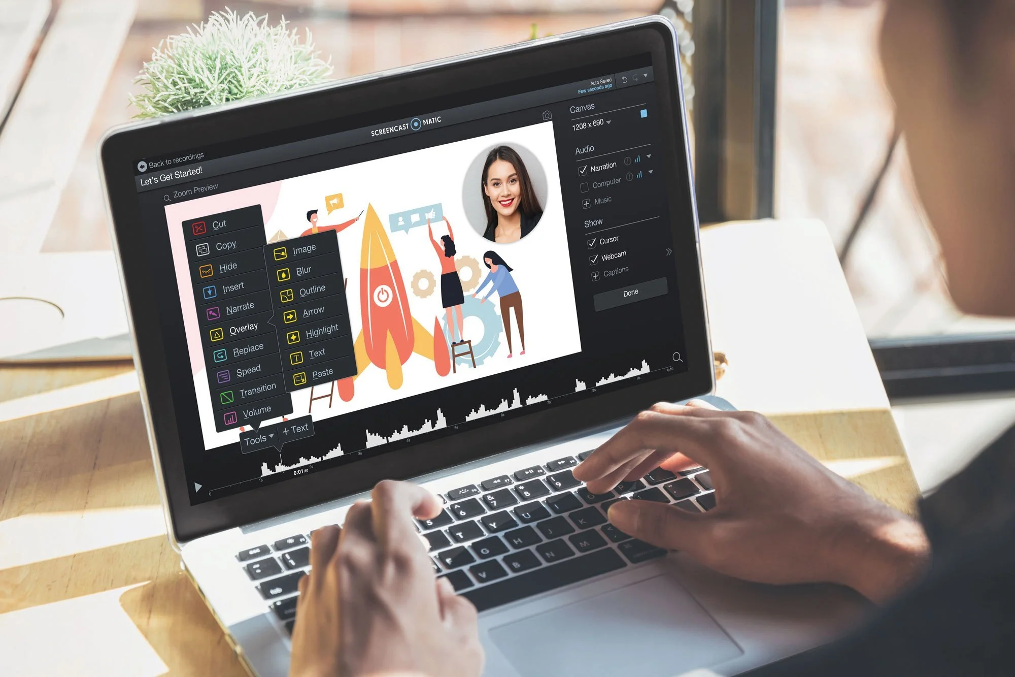 A person editing a video on a laptop screen with illustrations of people, gears, a rocket, and a woman’s portrait, using video editing software with various editing options on the screen.